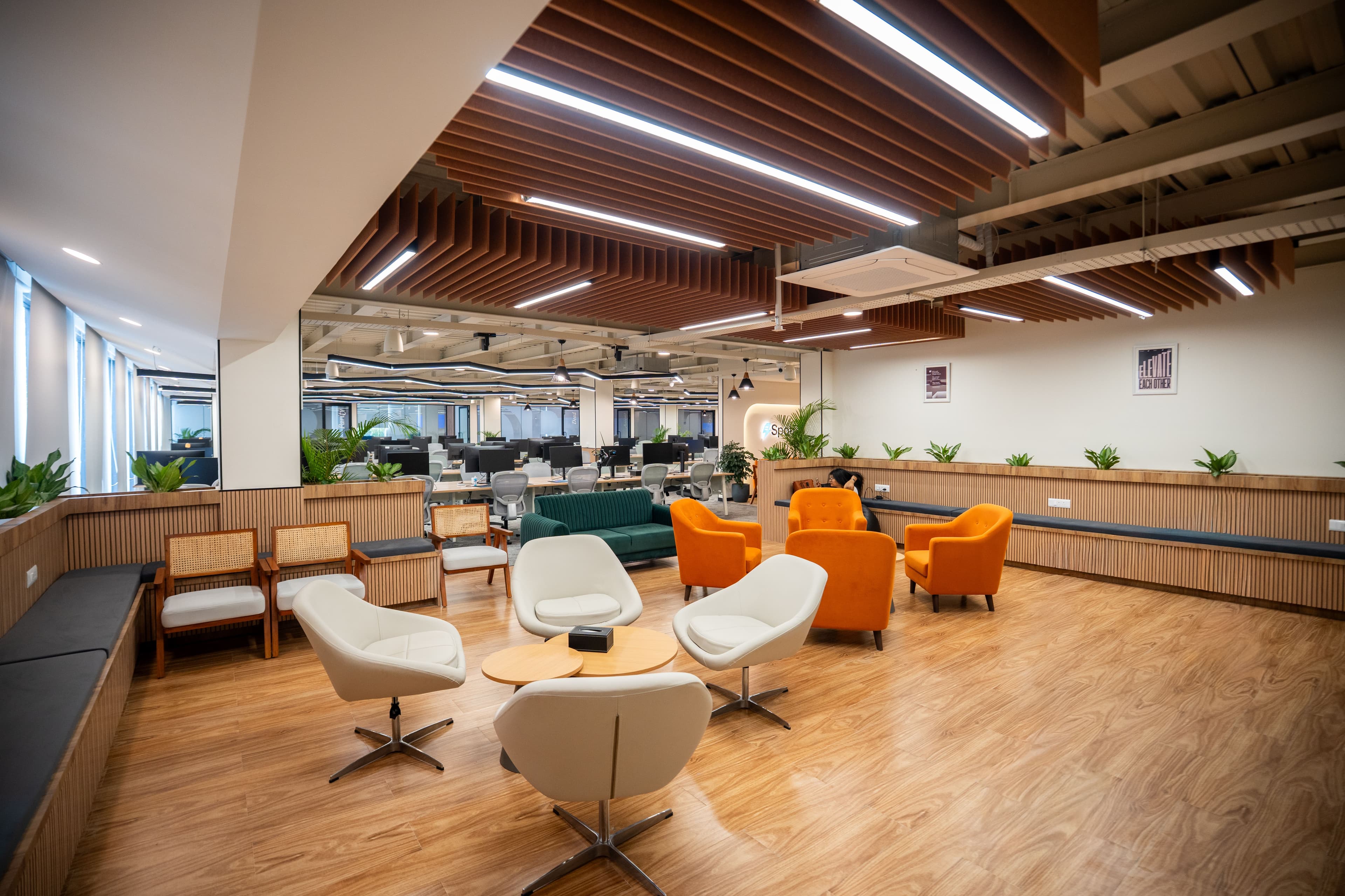 Variety of workspace zones including lounges and standing desks